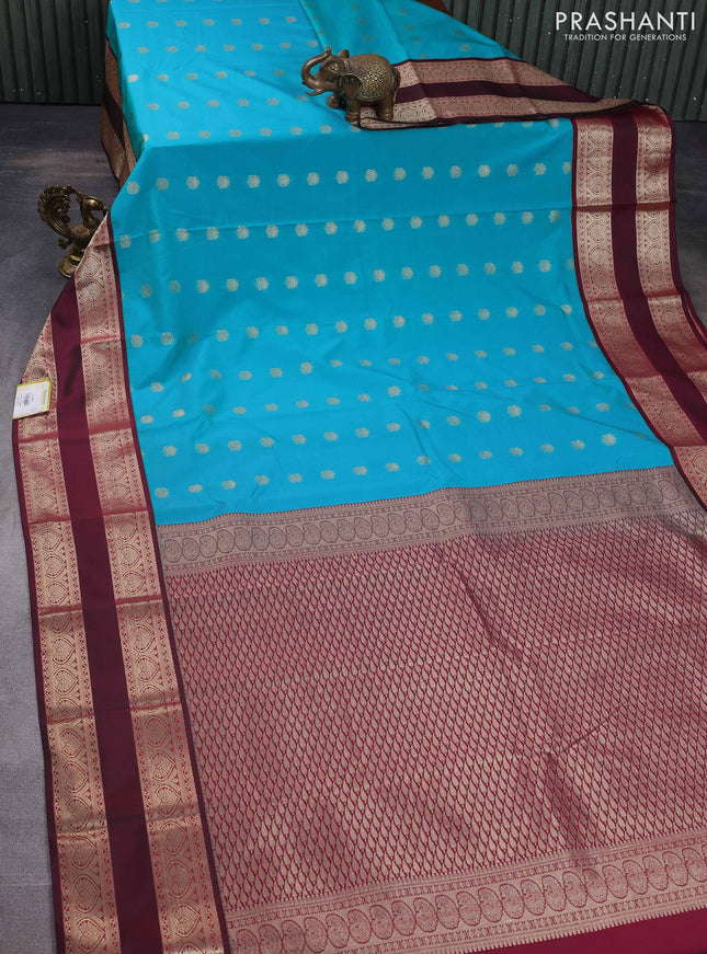 Semi kanchipuram silk saree teal blue and maroon with allover zari woven buttas and long rettapet zari woven korvai border