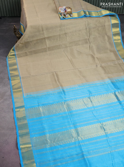Silk cotton saree beige and light blue with allover vairaosi pattern and zari woven border