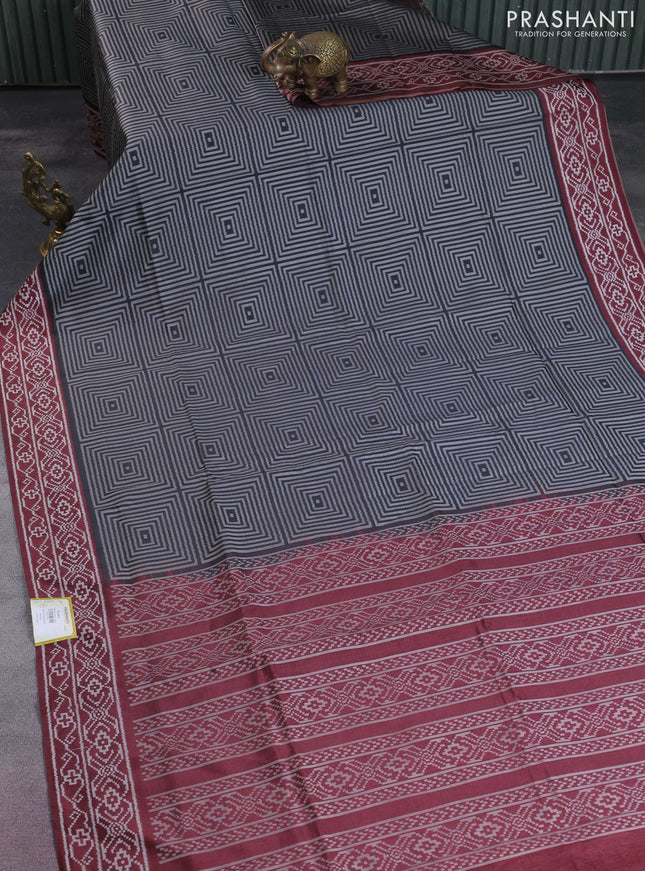 Sambalpuri semi silk saree black and deep maroon with allover geometric ikat weaves and thread woven border