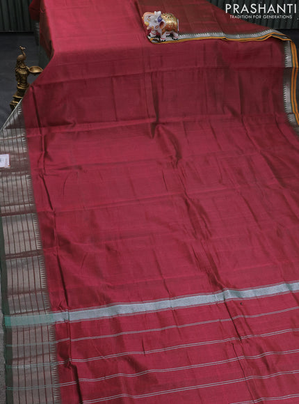 Mangalgiri silk cotton saree dual shade of maroon and green with plain body and silver zari woven border