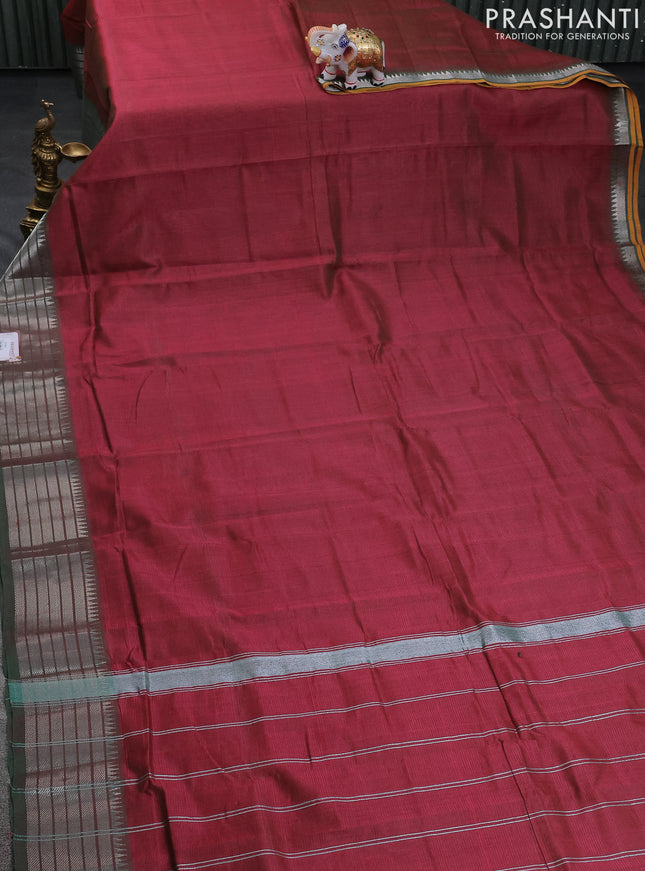 Mangalgiri silk cotton saree dual shade of maroon and green with plain body and silver zari woven border