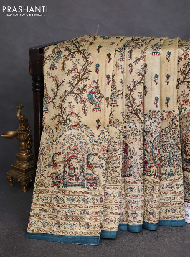 Tussar madhubani printed silk saree cream and peacock blue with allover prints and piping border