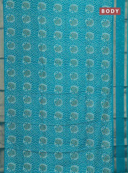 Semi dola saree teal green with allover bandhani prints and sequin work border