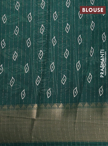 Semi dola saree green with allover zari weaves & leaf prints and zari woven border