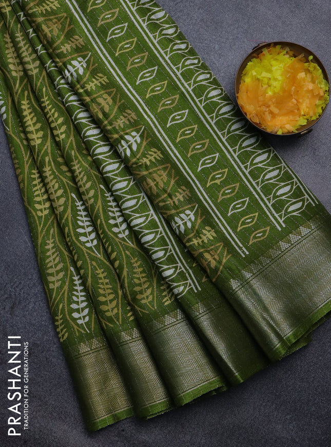 Semi dola saree light green with allover zari weaves & leaf prints and zari woven border