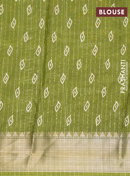 Semi dola saree light green with allover zari weaves & leaf prints and zari woven border