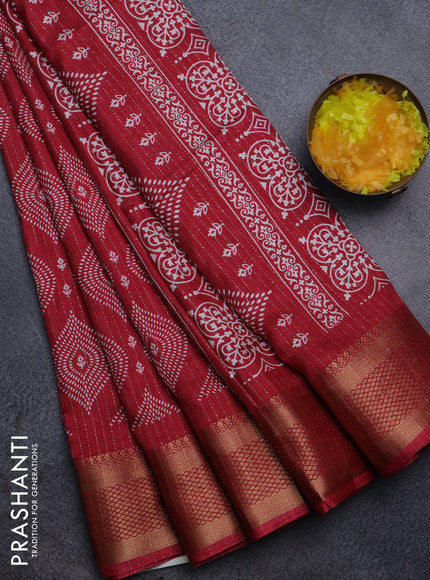 Semi dola saree maroon with allover zari weaves & prints and zari woven border