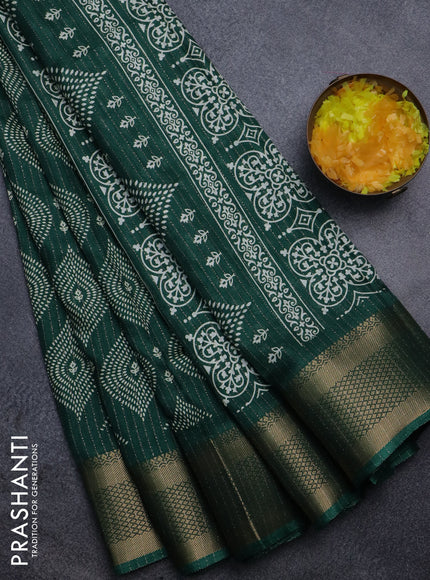 Semi dola saree dark green with allover zari weaves & prints and zari woven border