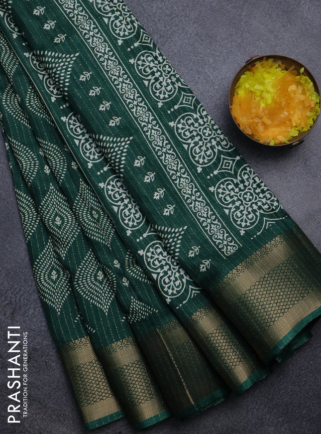 Semi dola saree dark green with allover zari weaves & prints and zari woven border