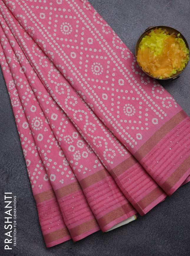 Semi dola saree light pink with allover bandhani prints and zari woven border