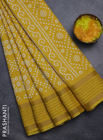 Semi dola saree yellow with allover bandhani prints and zari woven border