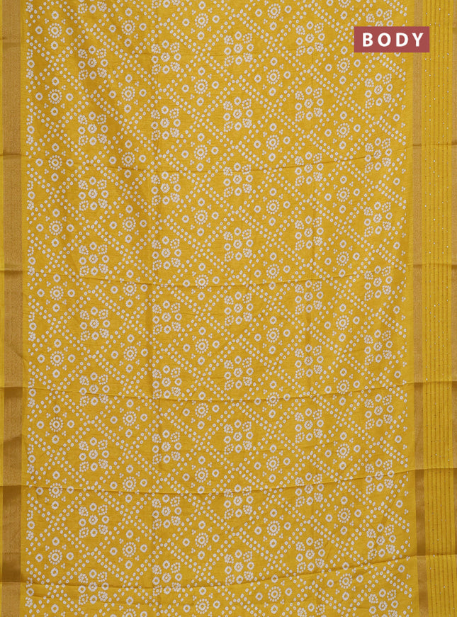 Semi dola saree yellow with allover bandhani prints and zari woven border