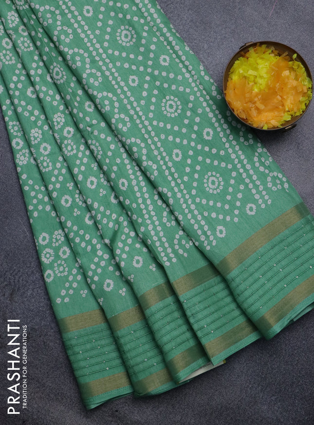 Semi dola saree pastel green with allover bandhani prints and zari woven border