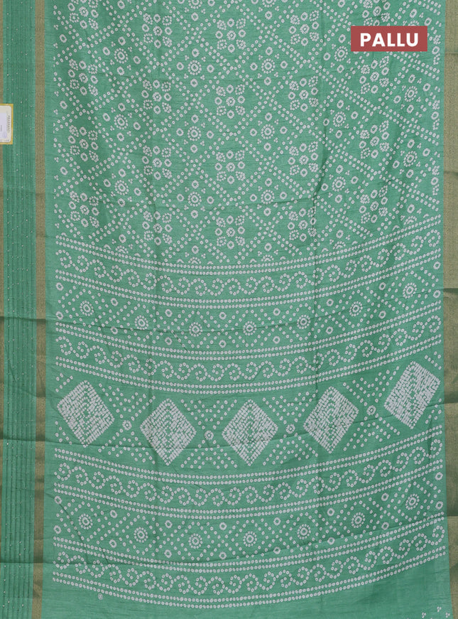 Semi dola saree pastel green with allover bandhani prints and zari woven border