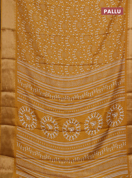 Semi dola saree mustard yellow with allover warli prints & zari weaves and zari woven border