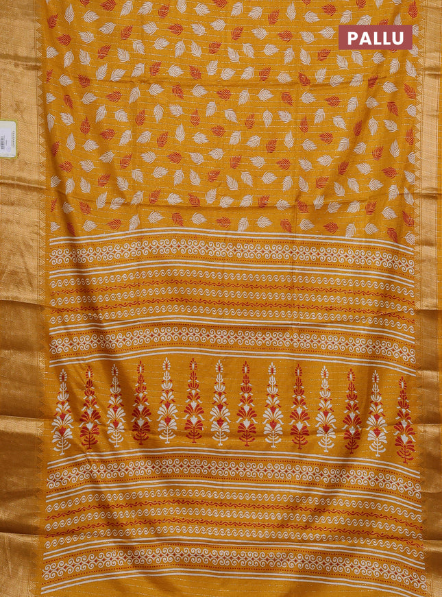 Semi dola saree mustard yellow with allover zari weaves & leaf prints and zari woven border