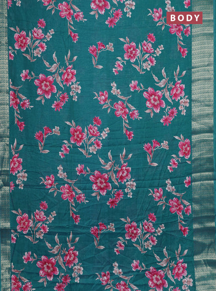 Semi dola saree teal shade with allover floral prints and zari woven border