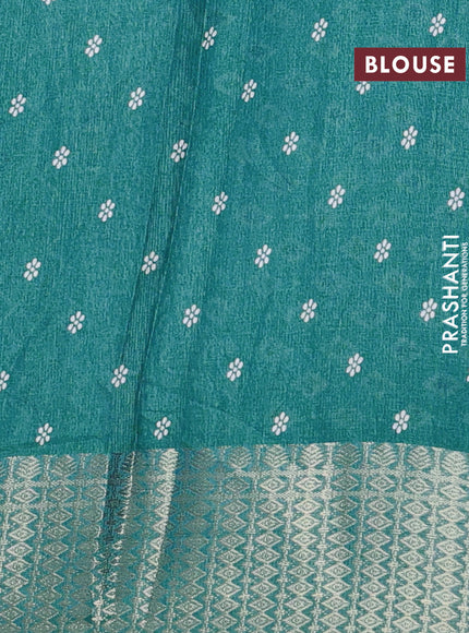 Semi dola saree teal shade with allover floral prints and zari woven border