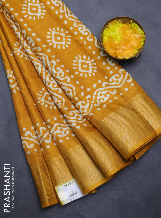 Semi dola saree mustard yellow with batik butta prints and zari woven border