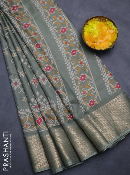 Semi dola saree greyish green with allover prints and zari woven border