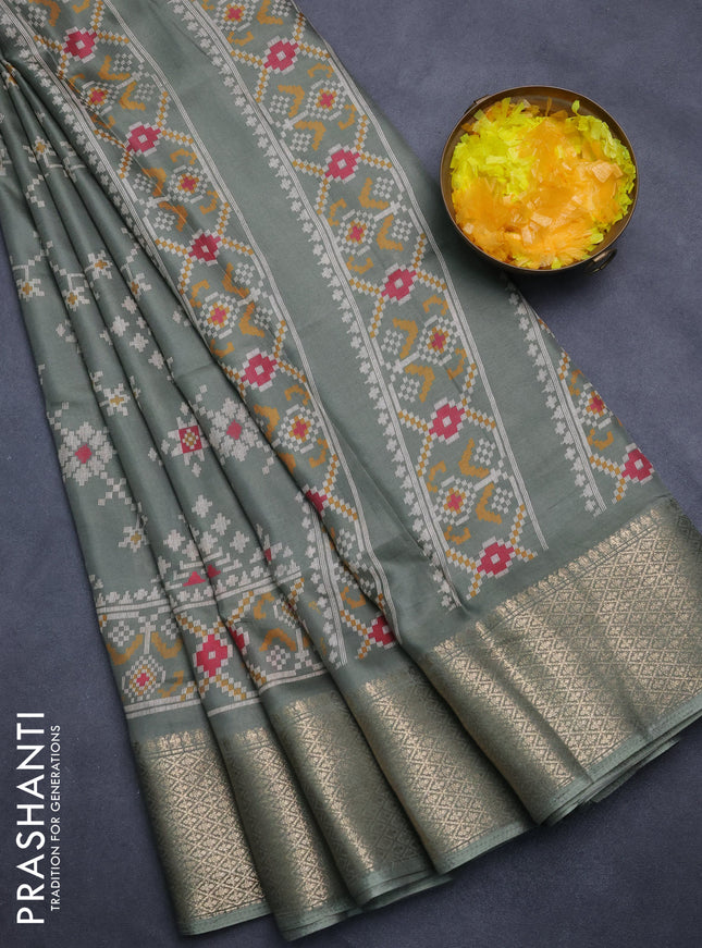 Semi dola saree greyish green with allover prints and zari woven border