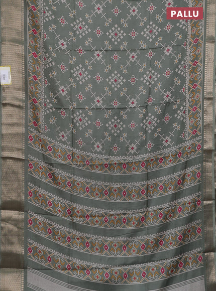 Semi dola saree greyish green with allover prints and zari woven border