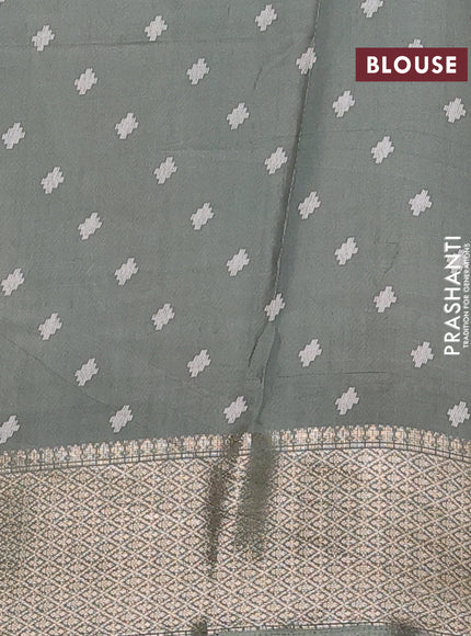 Semi dola saree greyish green with allover prints and zari woven border