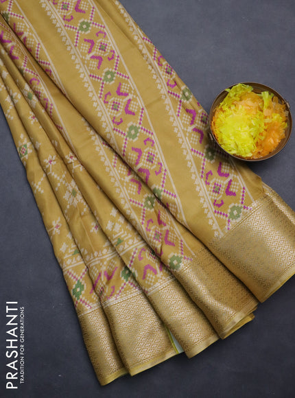 Semi dola saree pale yellow with allover prints and zari woven border