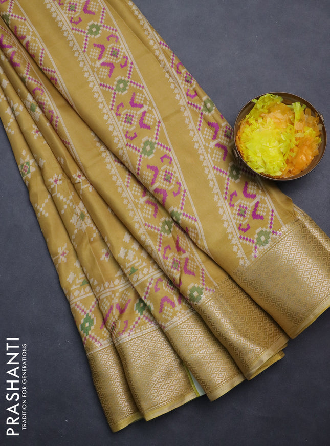 Semi dola saree pale yellow with allover prints and zari woven border