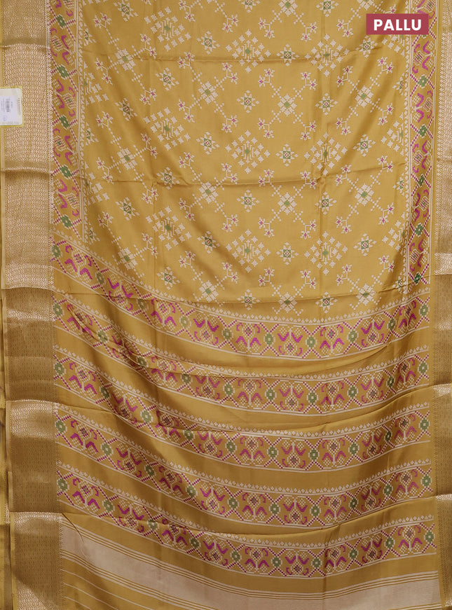 Semi dola saree pale yellow with allover prints and zari woven border