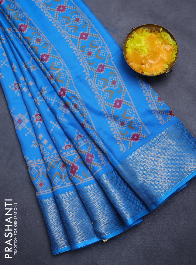 Semi dola saree cs blue with allover prints and zari woven border