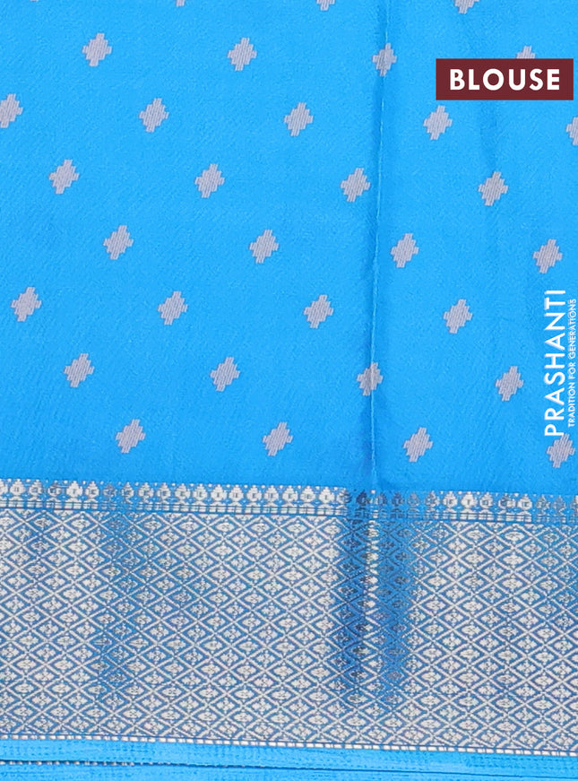 Semi dola saree cs blue with allover prints and zari woven border