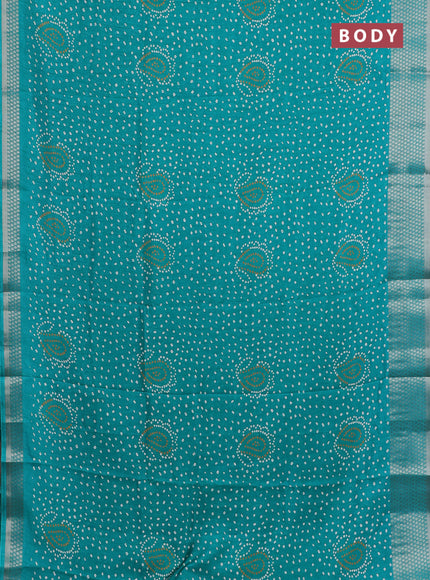Semi dola saree teal green with allover bandhani prints and zari woven border