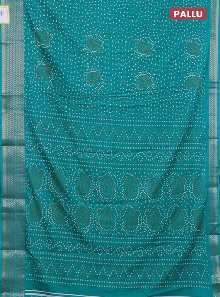Semi dola saree teal green with allover bandhani prints and zari woven border