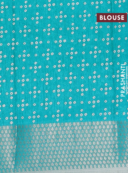 Semi dola saree teal green with allover bandhani prints and zari woven border
