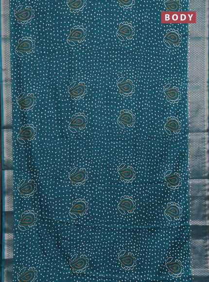 Semi dola saree teal green with allover bandhani prints and zari woven border