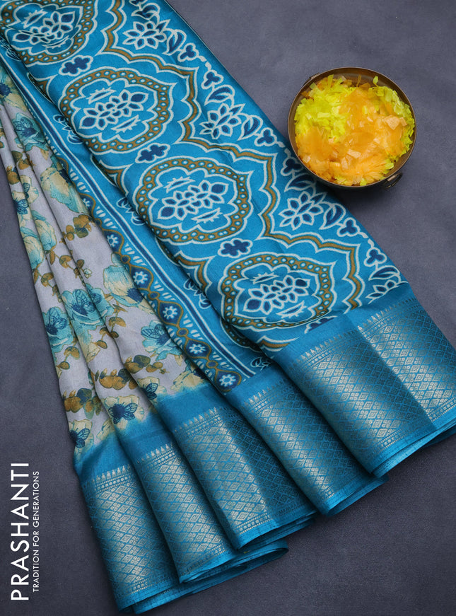 Semi dola saree grey and teal blue with allover floral prints and zari woven border