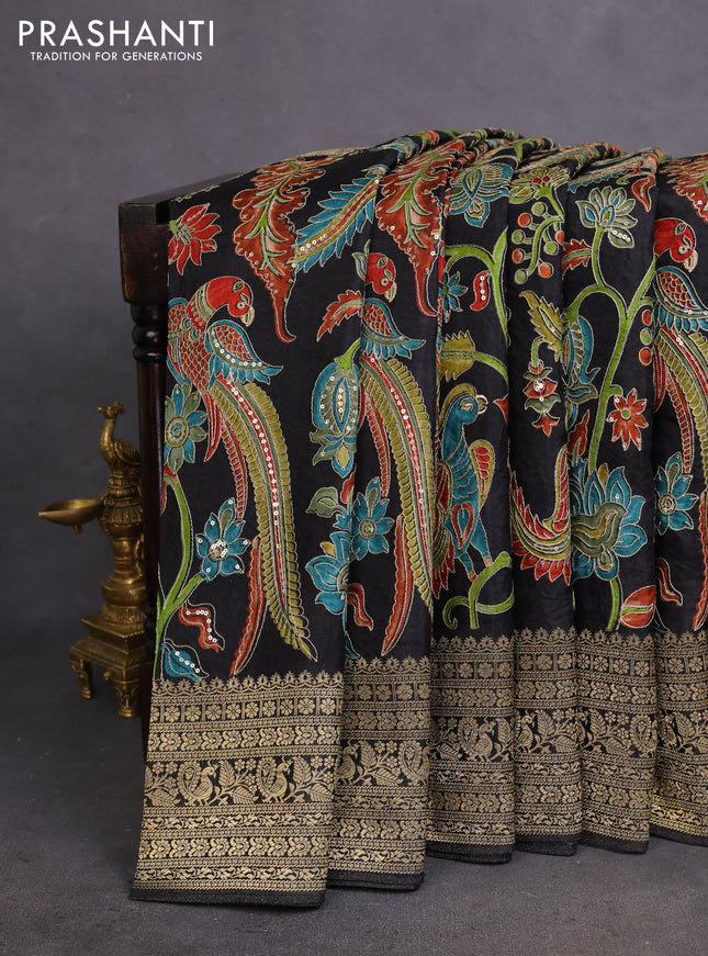 Crepe silk saree black with allover kalamkari prints & embroidery work and zari woven border