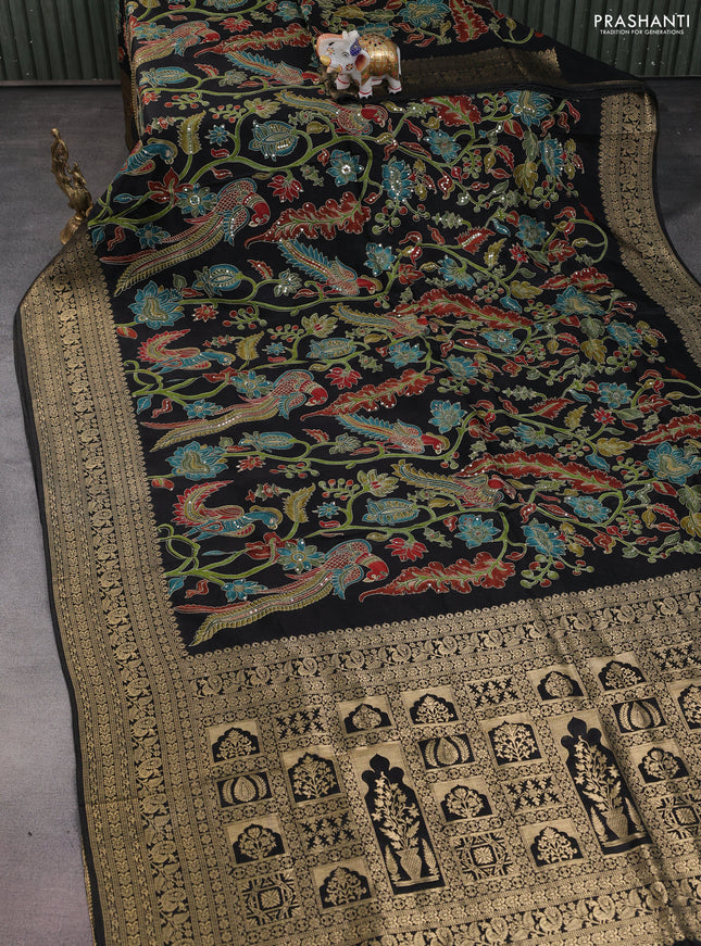 Crepe silk saree black with allover kalamkari prints & embroidery work and zari woven border