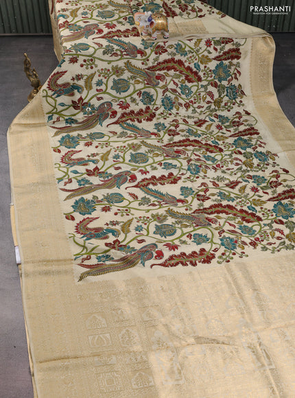 Crepe silk saree cream with allover kalamkari prints & embroidery work and zari woven border