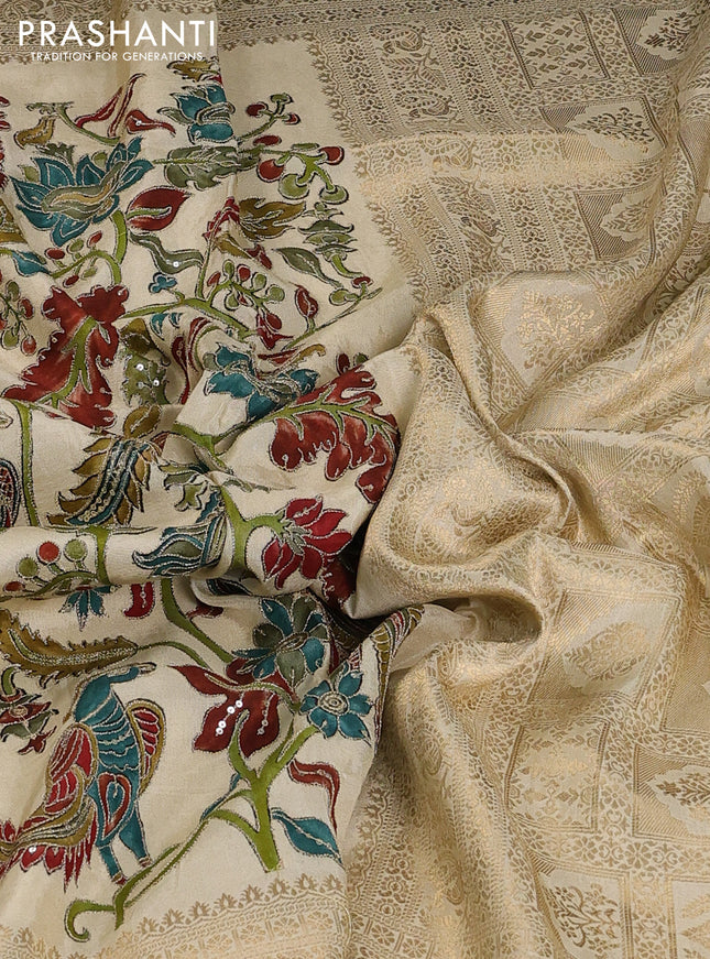 Crepe silk saree cream with allover kalamkari prints & embroidery work and zari woven border