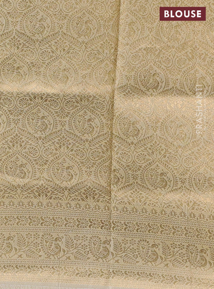 Crepe silk saree cream with allover kalamkari prints & embroidery work and zari woven border