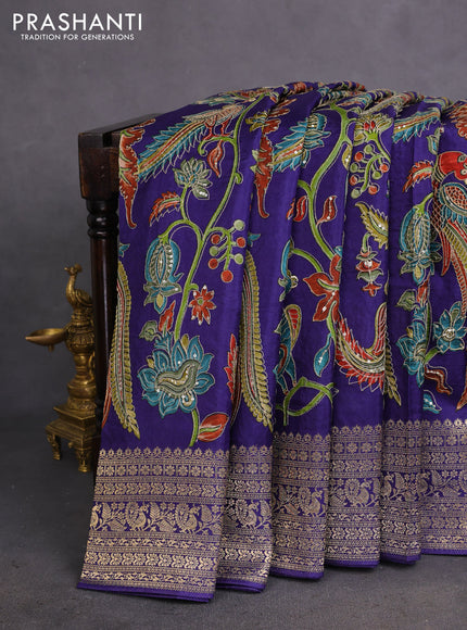 Crepe silk saree blue with allover kalamkari prints & embroidery work and zari woven border