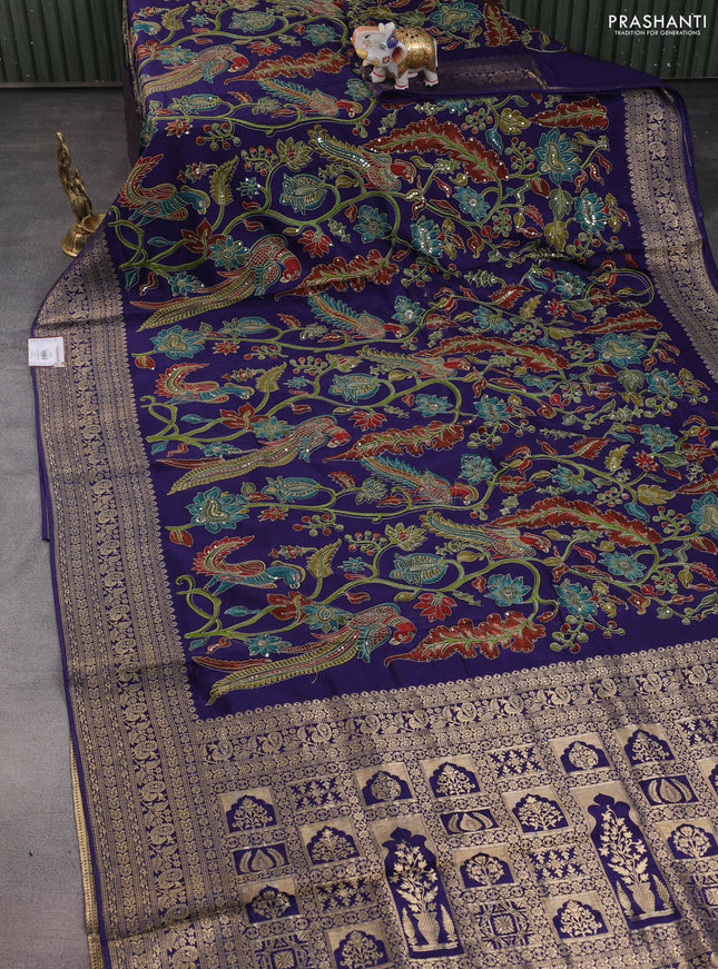 Crepe silk saree blue with allover kalamkari prints & embroidery work and zari woven border