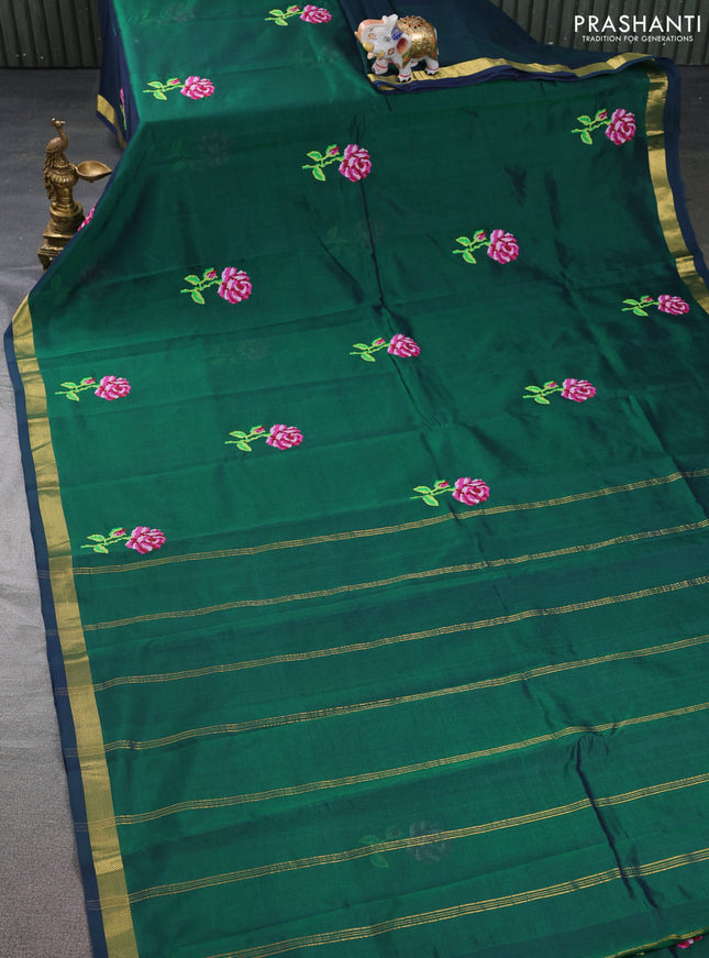 Silk cotton saree green with embroidery buttas and zari woven border