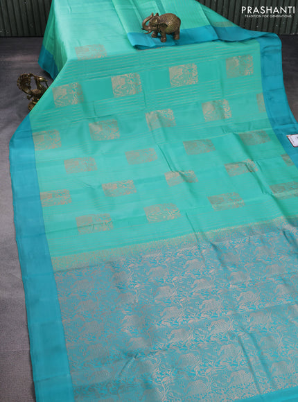Kanchipuram silk saree teal green shade and teal blue with allover copper zari weaves and simple border