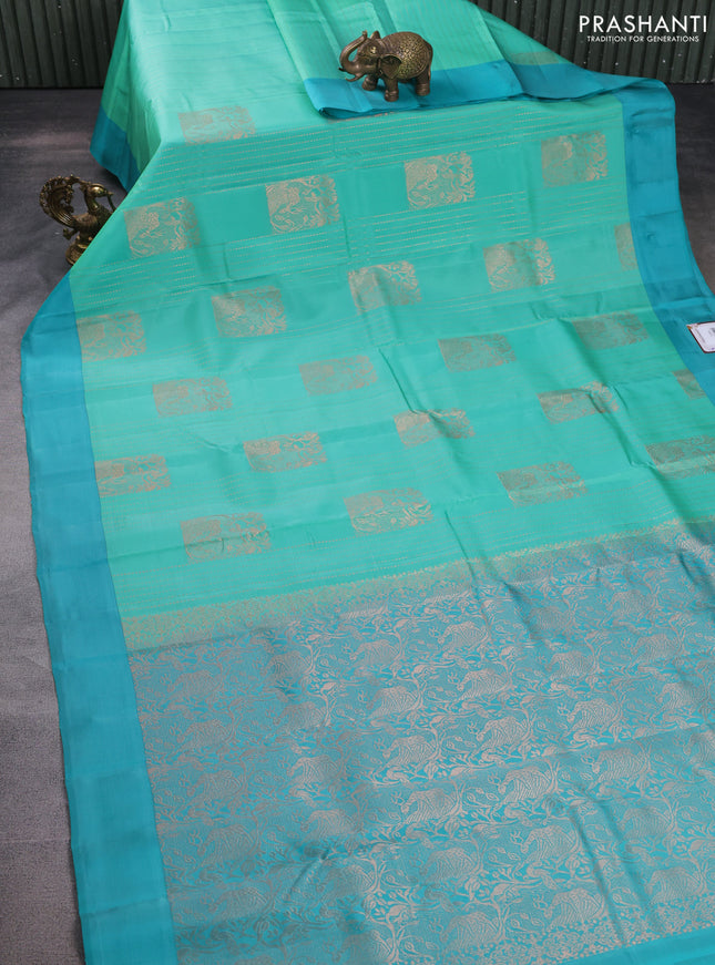 Kanchipuram silk saree teal green shade and teal blue with allover copper zari weaves and simple border