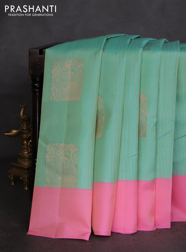 Kanchipuram silk saree dual shade of teal blue and light pink with allover copper zari weaves and simple border