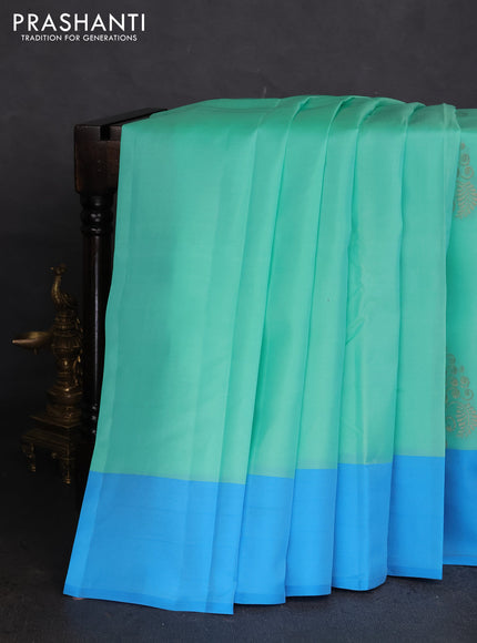 Kanchipuram silk saree teal green shade and blue with copper zari woven buttas and copper zari woven butta border
