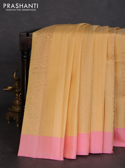 Kanchipuram silk saree pale yellow and light pink with allover copper zari weaves and simple border